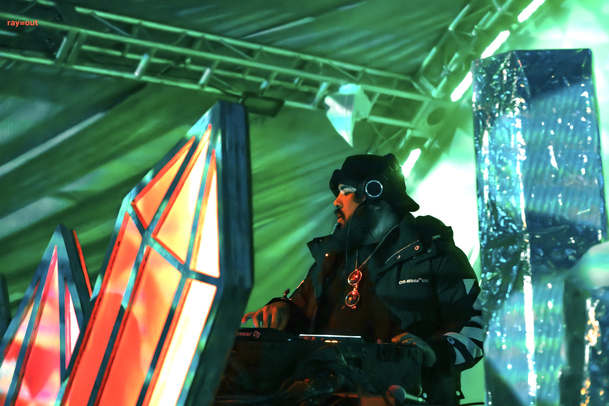 Multiple performers on stage with red and blue lighting