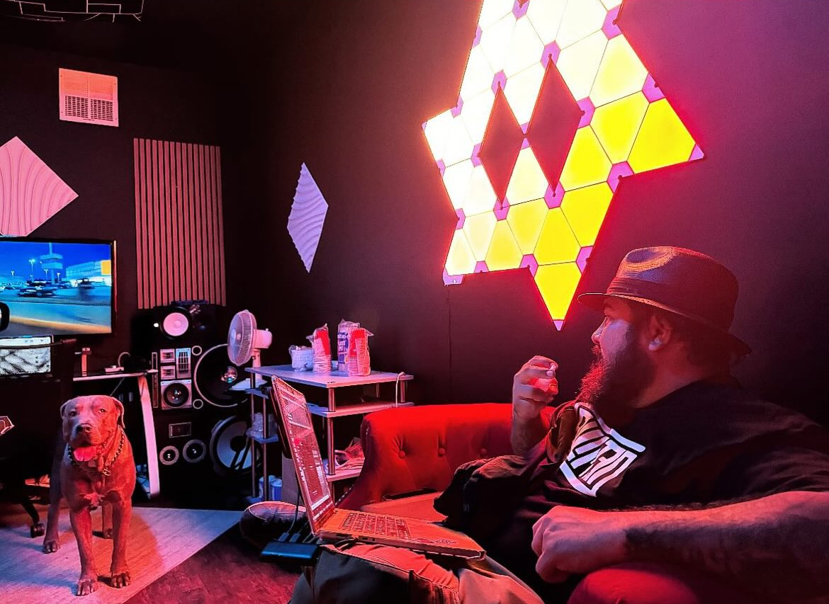 SERGIK DJing with Pioneer equipment, purple and orange lighting